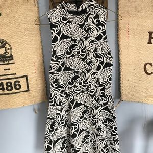 Patterned black and white dress with high neck